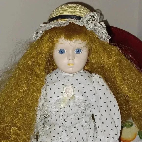 Heritage Other - Vintage Tina America's porcelain doll with hat and polkadot dress.